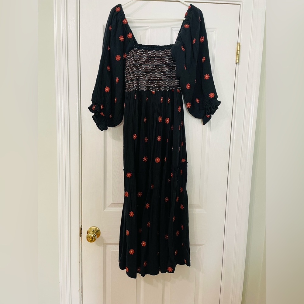 Free People dress - size small. Smocked on top and flowy with 3/4 sleeve.